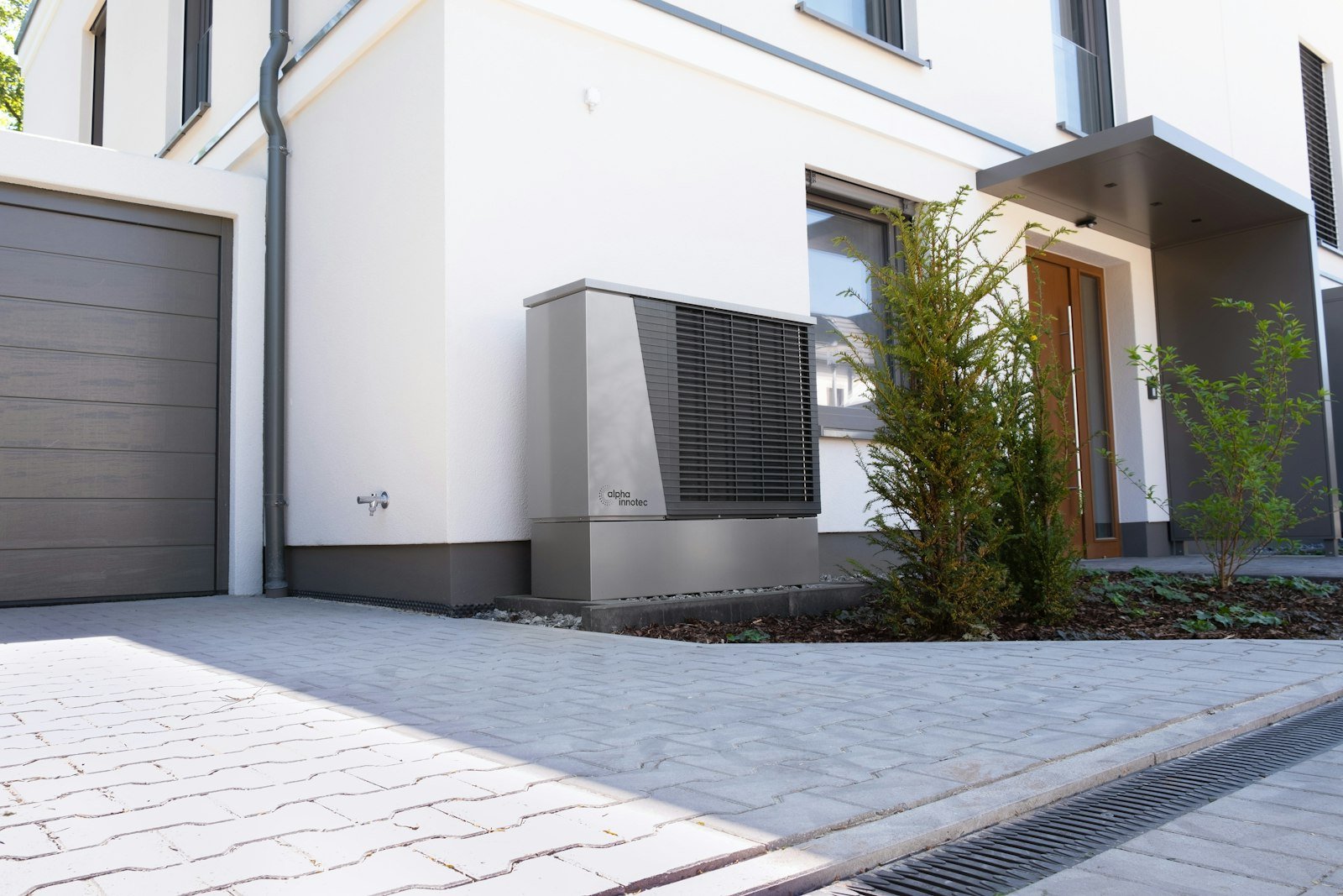 Modern home with an outdoor heat pump unit for heating and cooling